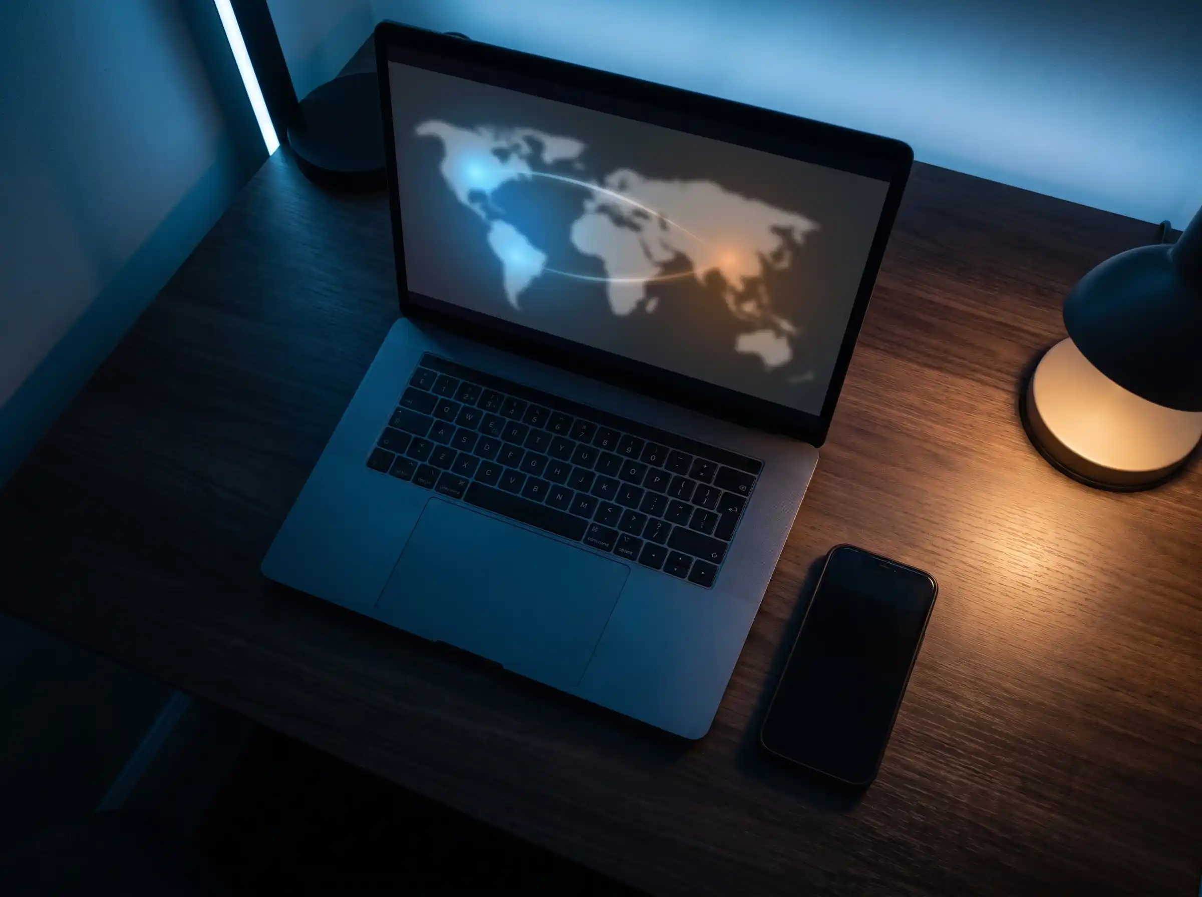 Laptop displaying a world map graphic representing global CDN routing behind Kuaishou video hosting